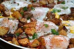 Potato, Carmelized Onion, & Roasted Red Pepper Hash with Baked Eggs & UP Olive Oil